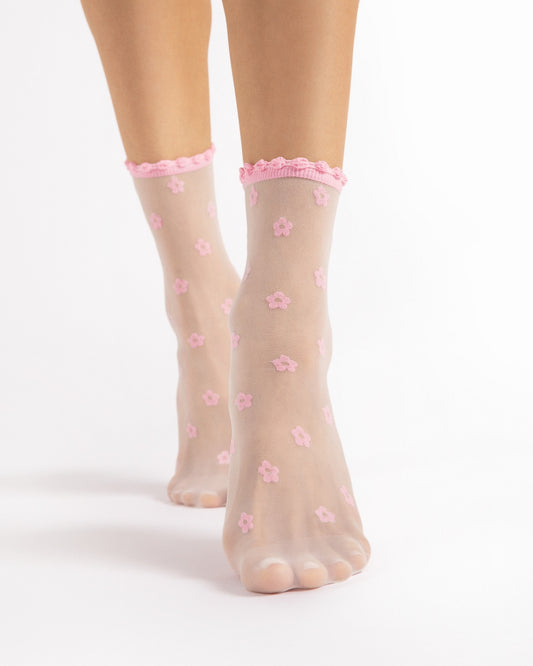 Białe damskie skarpetki rajstopowe różowy wzór w kwiatki bezuciskowy ściągacz z falbanką Fiore April 15 DEN