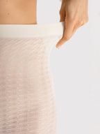 Wzorzyste bezmajtkowe rajstopy kryjące kolor ecru motyw kropek Fiore Moonrise 60 DEN